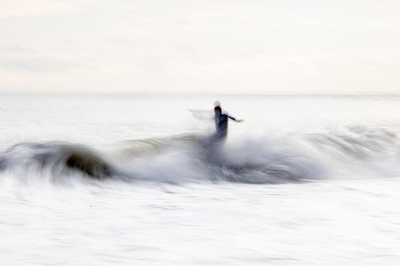 Surfer catching a wave